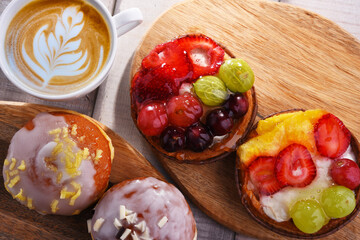 Composition with confectionery products and cup of coffee