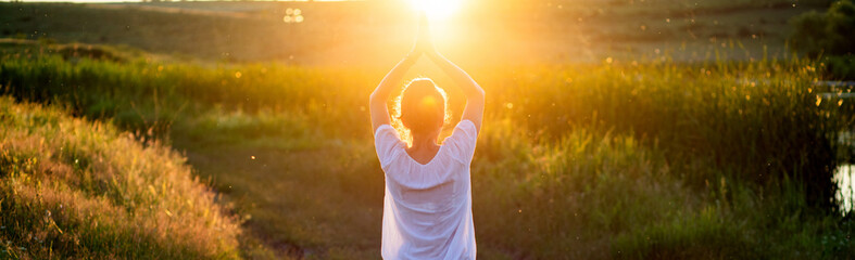 woman in a yoga pose at sunset by lakeside mindfulness and mental health