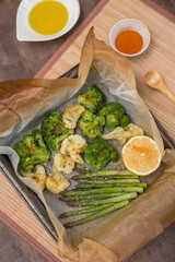 Baked asparagus broccoli and cauliflower. Vegan healthy diet dish