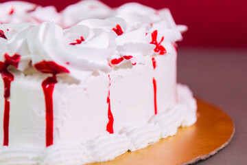 Close up of a cake with dressing on the side