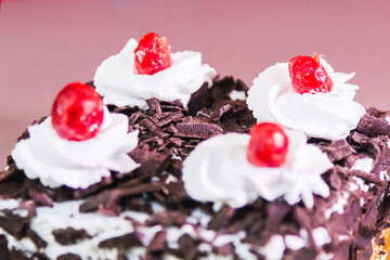 Chocolate cake with cherry on the top