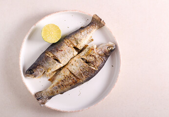 Fried rainbow trout fish served