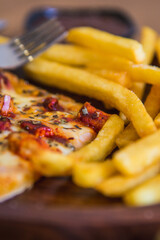 Pizza with fries and seasonings