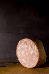 Sliced salami on cutting board.Toned