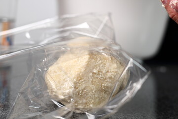 Wrap dough ball in plastic film. Making Shoofly Tart Series.