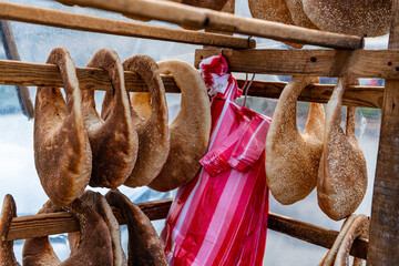 Traditional Lebanese Kaak bread for sale. A handbag shaped bread usually sold on the streets - obrazy, fototapety, plakaty