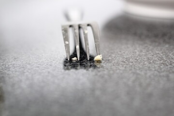 Dirty fork on granite surface. Making Shoofly Tart Series.