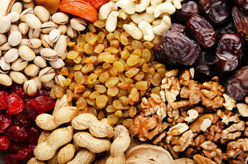 Flat lay view at assorted dried fruits and nuts. Healthy vegetarian food concept