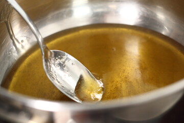 Melting golden syrup in saucepan. Making Shoofly Tart Series.