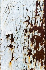 Rusty painted metal. Texture of rusty iron wall. Cracked paint on an old metallic surface. Cracked and flaky paint, abstract rusty metal texture, rusty metal background. Metal corrosion