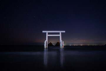 floating torii in ocean and starry