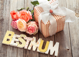 Mother's day background with lettering and roses.