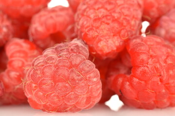 Juicy organic red raspberries, close-up.