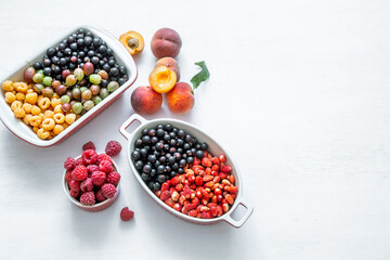 Composition with a variety of fresh berries and fruits