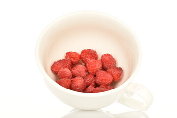 Juicy organic raspberries, close-up, on a white background.