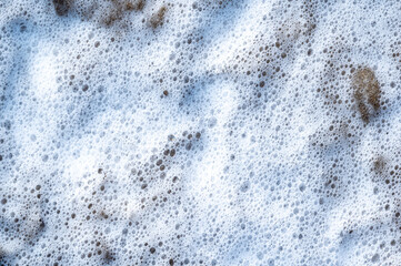 Overview of sea foam at Holland on Sea, Essex,