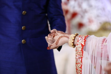 Bride and Groom Closeup hands  and dress 