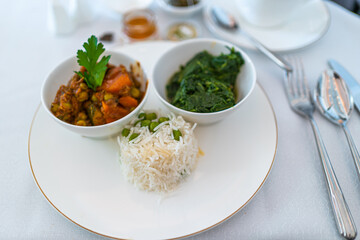 Indian food set including basmati rice, curry, and vegetable