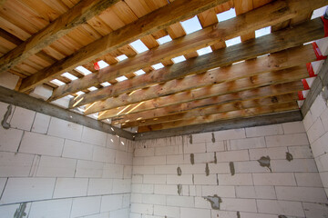 house under construction with autoclaved aerated concrete block structure at building site