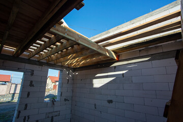 house under construction with autoclaved aerated concrete block structure at building site