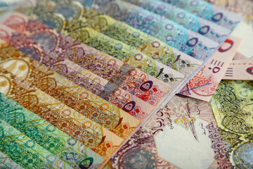  Currencies and money exchange trading concepts. Qatari 500 ,100,50,10,5,1 Riyals Bank Note .& Coins ,Qatari Currency roll
