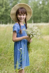 Poster Amazing smiling girl with bouquet of flowers on the field © Albert Ziganshin