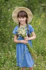 Fotobehang Amazing smiling girl in a hat with bouquet of flowers © Albert Ziganshin