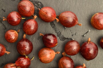 Ripe organic agrus, close-up, on a slate board.