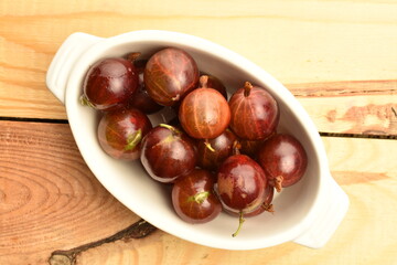 Ripe organic agrus, close-up, on a wooden table.