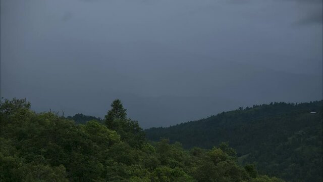 Time-lapse of Rain and Clouds move along the Valley surrounded by mountains in Shirui, Manipur, one of the Northeastern states of India shot in 4k