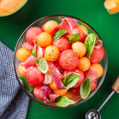 Fruit salad with melon cantaloupe, watermelon and prosciutto