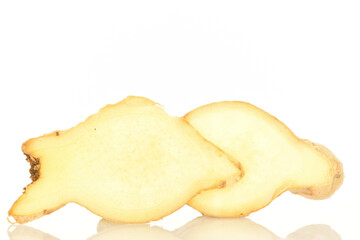 Ripe ginger root, close-up, on a white background.