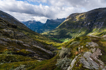 Fototapeta na wymiar Norwegian valley surrounded by mountains on a summer day