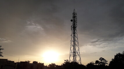 Telecommunication tower with clouds and sky 