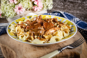 Pork stew served with noodles.
