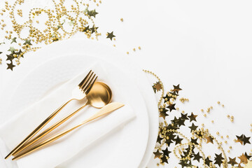 Golden table setting with shiny stars and beads on white. Space for text.