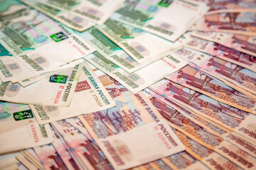 Obraz na płótnie Canvas Modern cash Russian rubles. Paper bills laid out on the table
