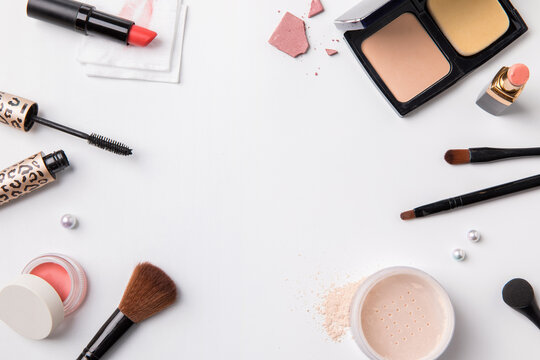 decorative cosmetics, makeup brushes and accessory on white background. flat lay.