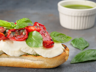 Sandwich with mozzarella cheese and sun-dried tomatoes.