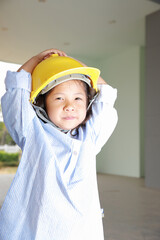 Education concept, Asia kid girl posing in engineers dress.