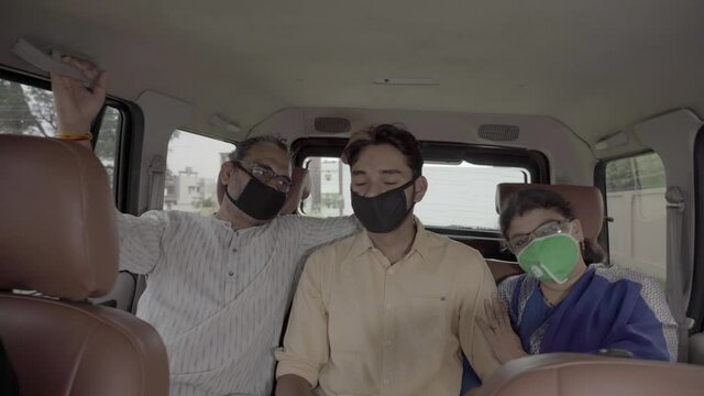 Happy Indian family, wearing mask for protection against Coronavirus.