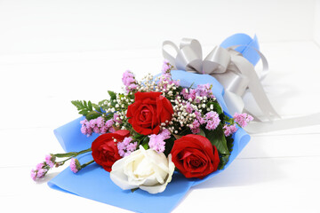 Bouquet of roses on white wood. With copy space, concept valentine day.