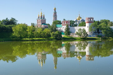 Fototapeta na wymiar Summer view of the Novodevichy monastery from the pond. Moscow, Russia