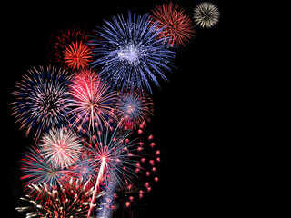 Red and blue fireworks display fills the sky during night time celebration