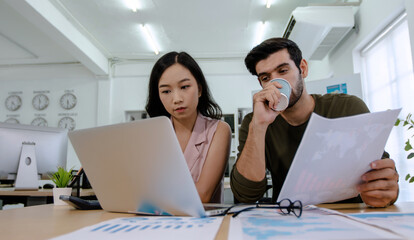 Girl business woman sitting on wooden table with laptop, explaining and discussing with her mentor boss teacher, colleague and working together and team work concept