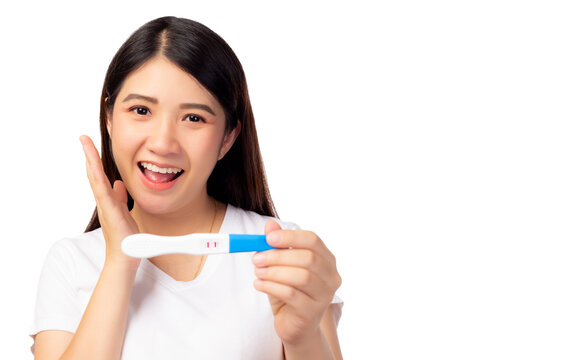 Happy Pregnant Woman Holding Pregnancy Test And Get Happy And Good News That Asian Woman Has Baby With Smiley Face. Young Mother Waiting Newborn Baby Prenatal, Pregnancy, Motherhood, Expecting Concept