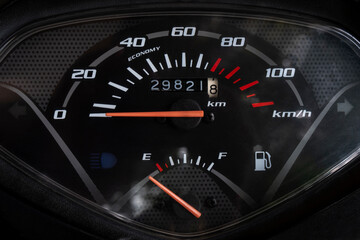 Naklejka premium closeup shot of scooter speedometer black dash board