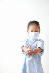 Kid girl wearing mask for protect dust pm 2.5, virus and bacteria. Protection from sprayed saliva from patients. Show the two hand as a 