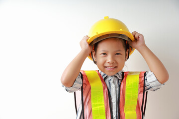 Kid girl smile happy wearing reflective shirts and wearing hard hat yellow. To learning and enhance development, little architect.