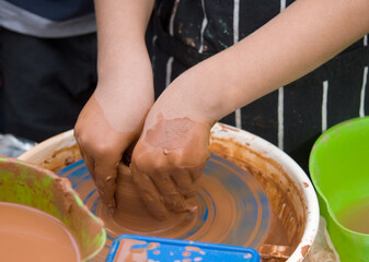 tha child`s hands are made of clay